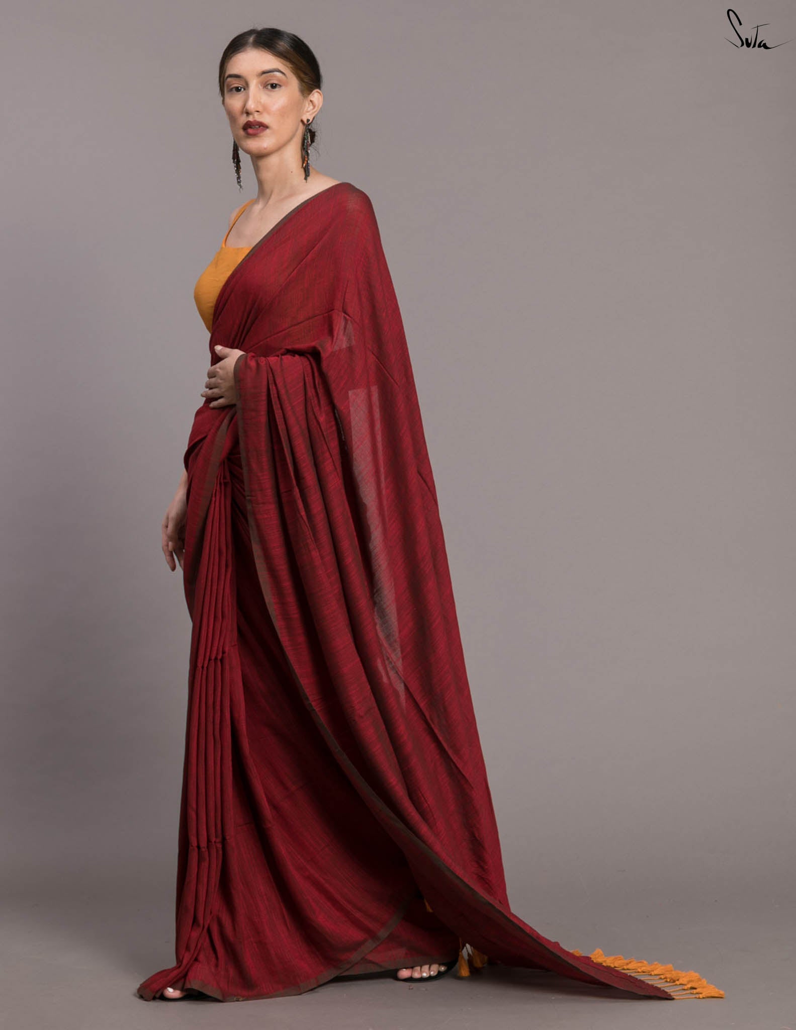Suta Maroon Solid Cotton Blend Saree