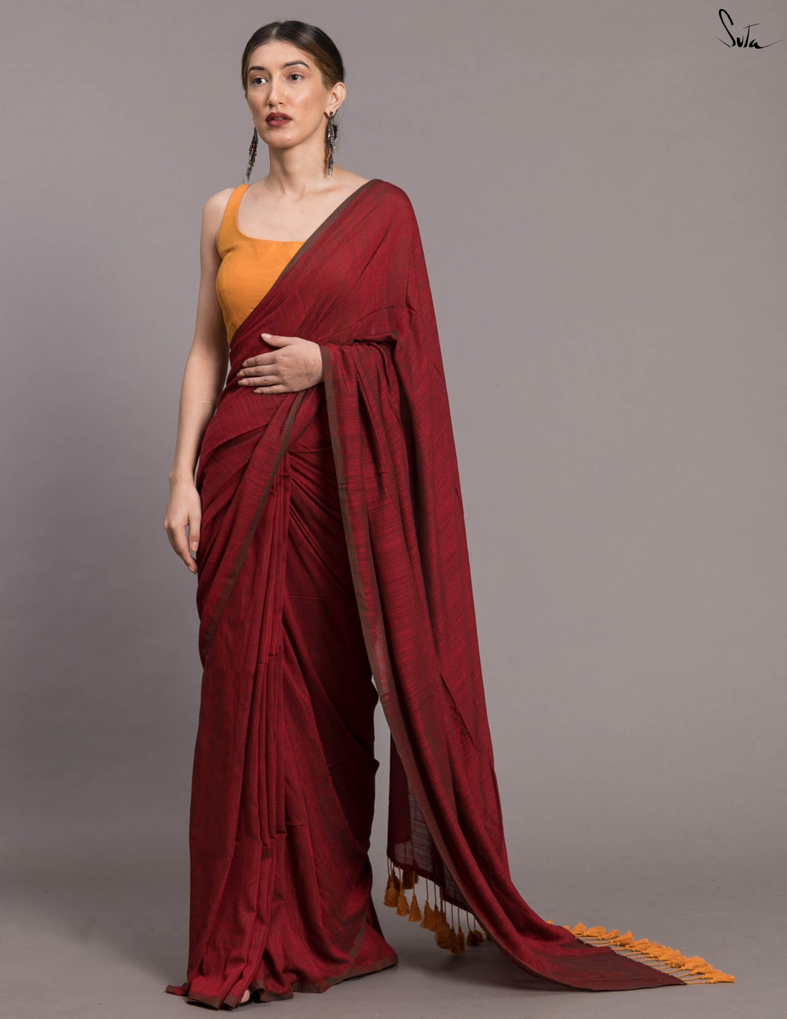 Suta Maroon Solid Cotton Blend Saree